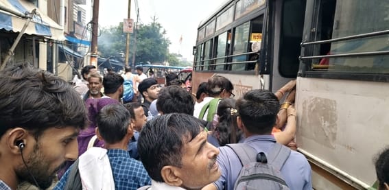 Excitement for free travel; crowds seen on roadways buses.