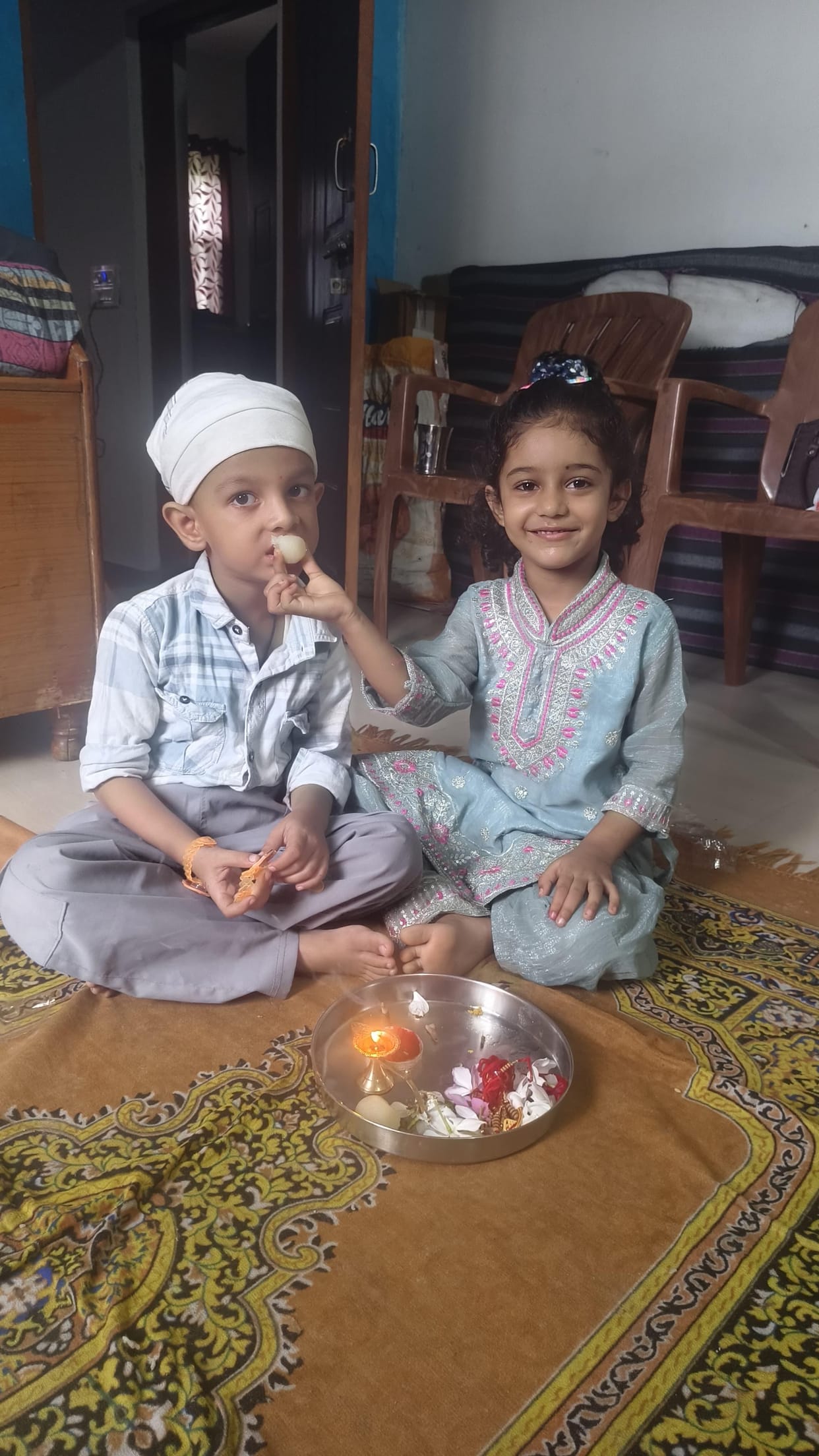 The Rakhi adorned the brother's wrist; sisters prayed for his well-being.