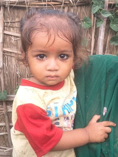Innocent child rescued after falling into a water-filled pit.