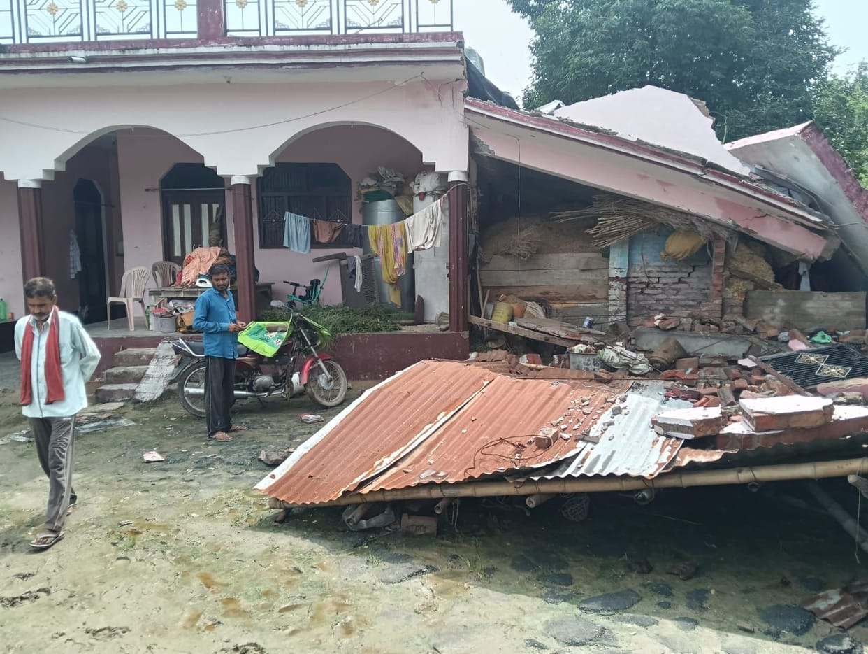 Two-story house collapses after being struck by lightning; seven people trapped.