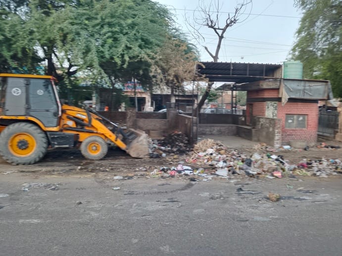 Cleanup operations were carried out under police guard; when female employees stepped forward to stop it, they were picked up and loaded into vehicles