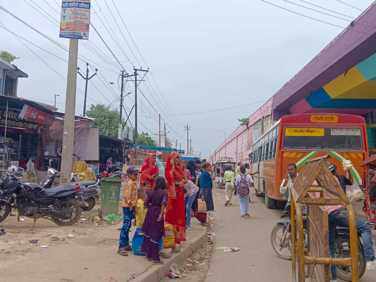 Sisters waiting for buses after tying Rakhis.