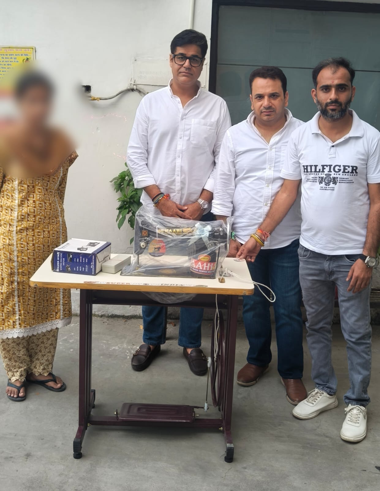Madad Seva Society gifts a sewing machine to a needy woman.