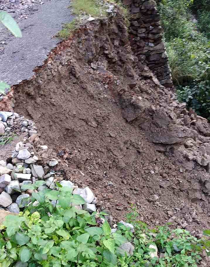 The foundation stone bears witness, while the road suffers the brunt of a dilapidated state.