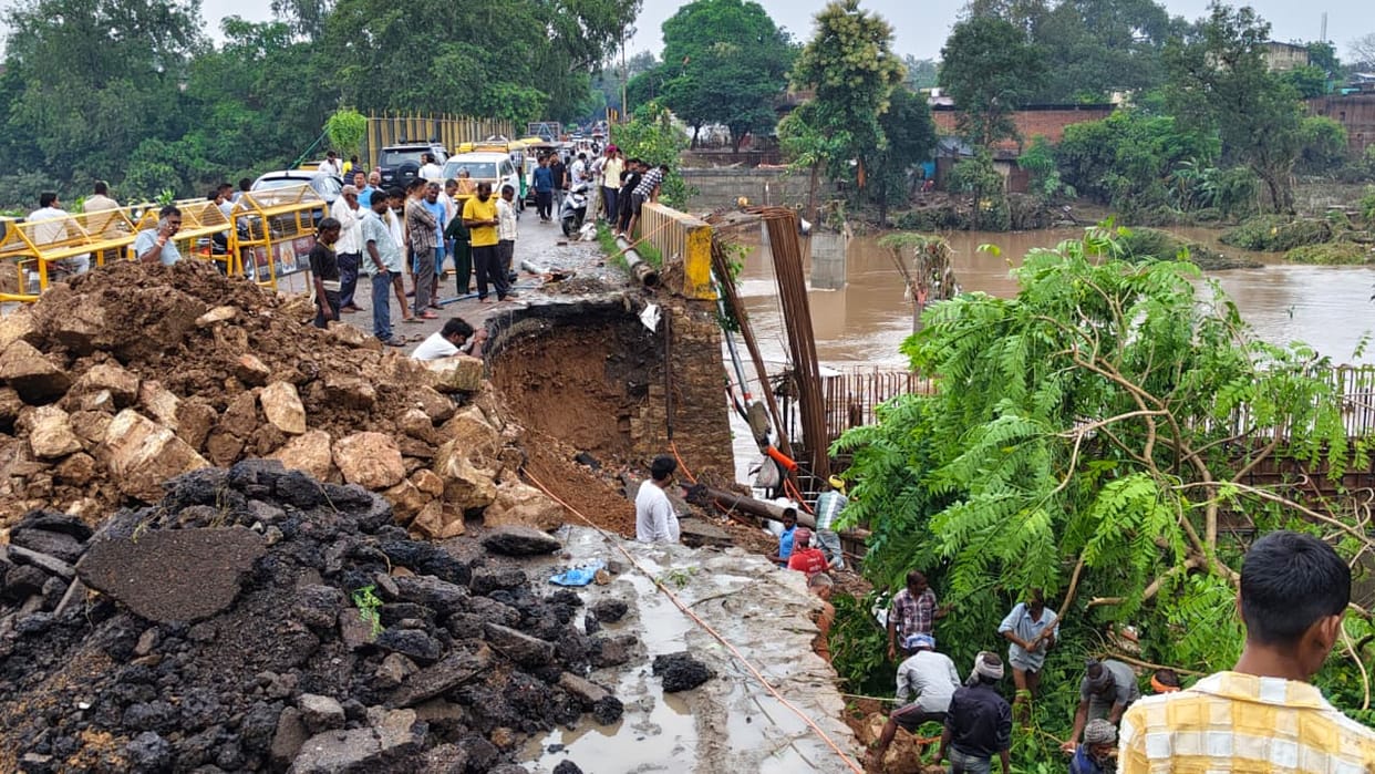 The approach road to the bridge collapsed as the water level of the Mandakini dropped.