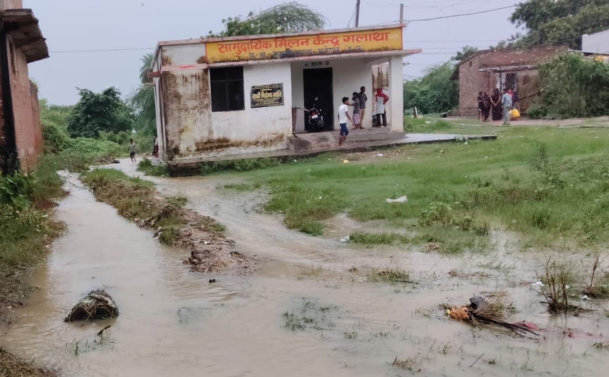 Villagers are transporting household goods to safe locations by boat.