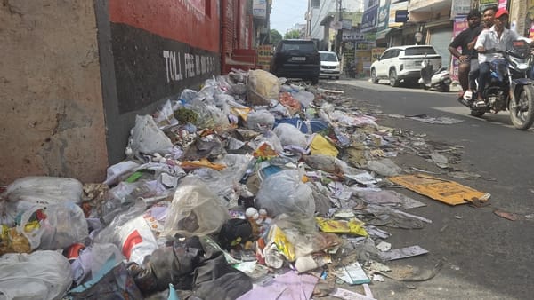 Sanitation system stalled: Garbage piles mounting on the streets.