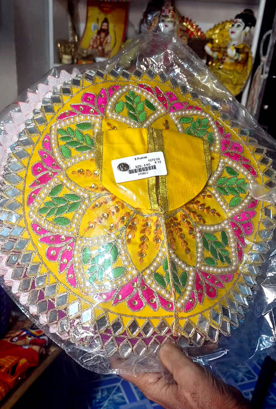 Markets decked up for Janmashtami; pearl-studded outfits appeal to devotees.