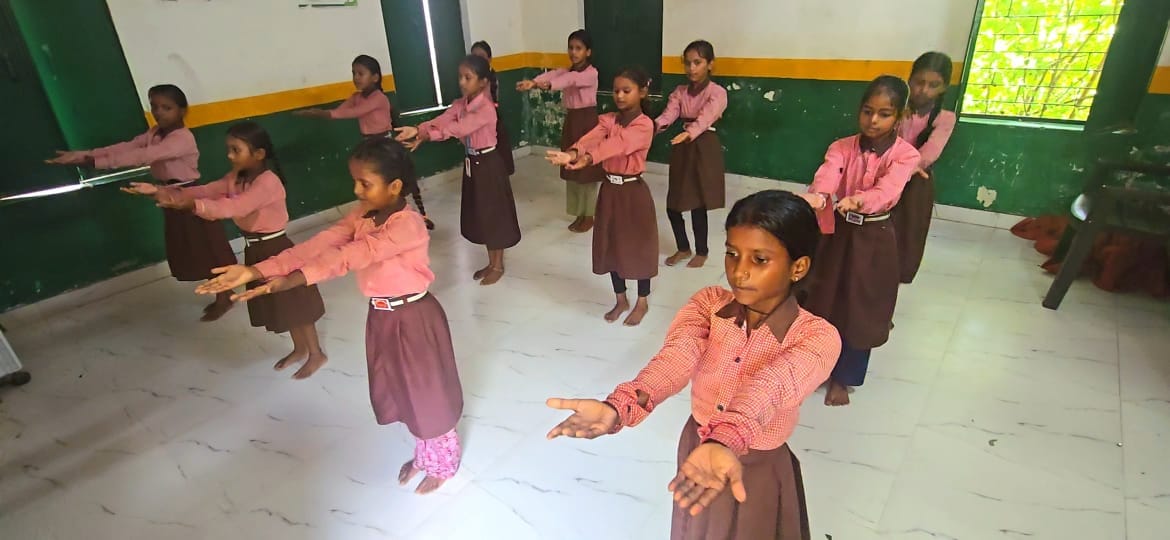 Children at school are learning music alongside their studies.