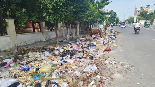 Councilor's representative attempts to get garbage cleared; sanitation workers create a ruckus.