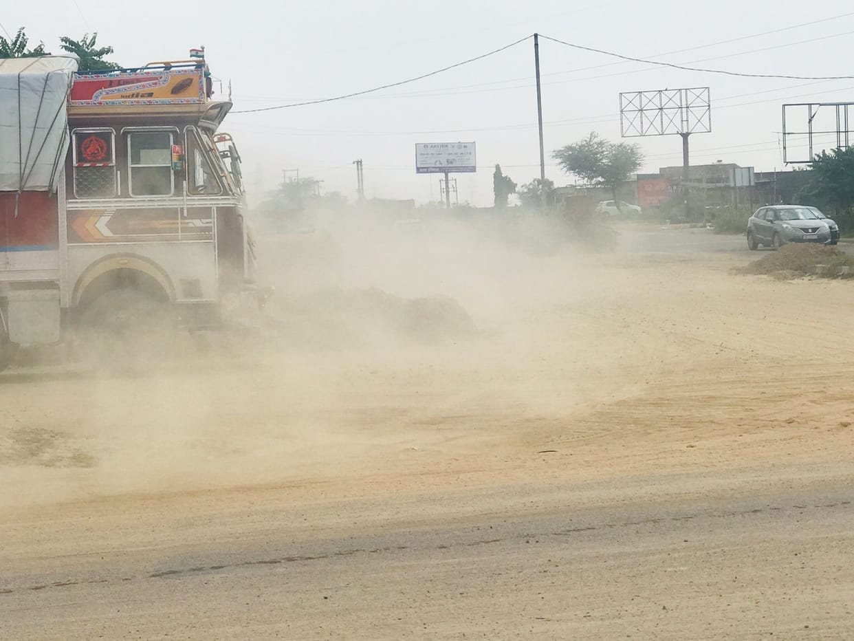 Chaos ensues as soon as overbridge construction begins at Haluwas Chowk; dust rises from the soil dumped on the road.