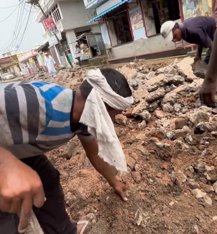 Construction resumes on road left incomplete for a year.