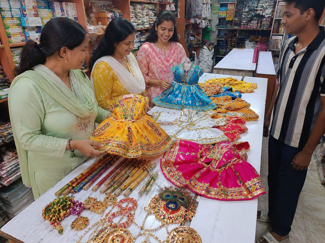 Preparations to dress up children as Radha and Krishna.