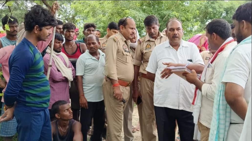 The body of a youth who drowned in the river was found stuck in a tree.