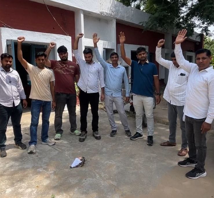 Electricity corporation employees burned copies in protest against privatization.