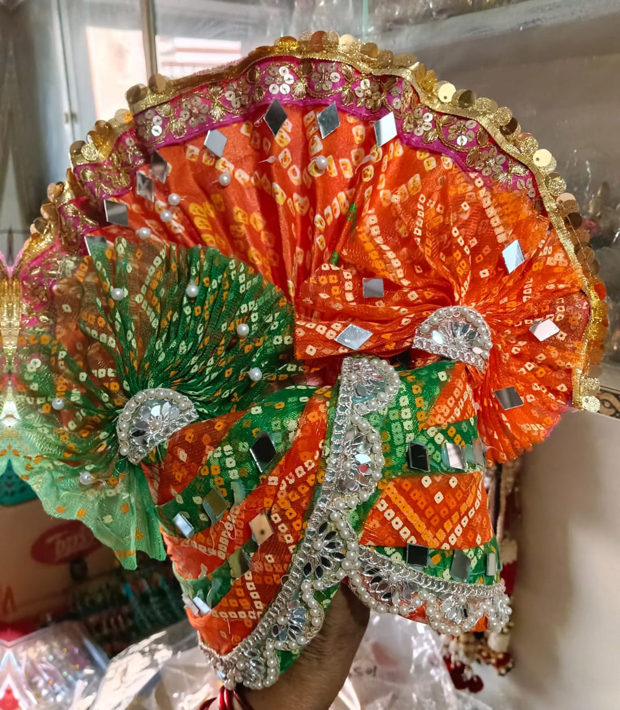 Decorated colorful clothes and makeup for Laddu Gopal in the market