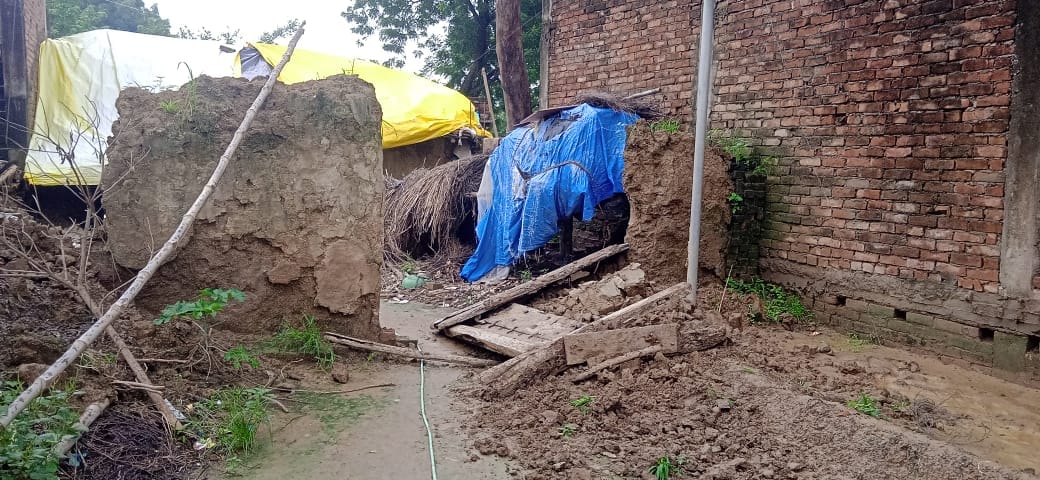 Mud house collapses due to dampness from rain; woman has a narrow escape.