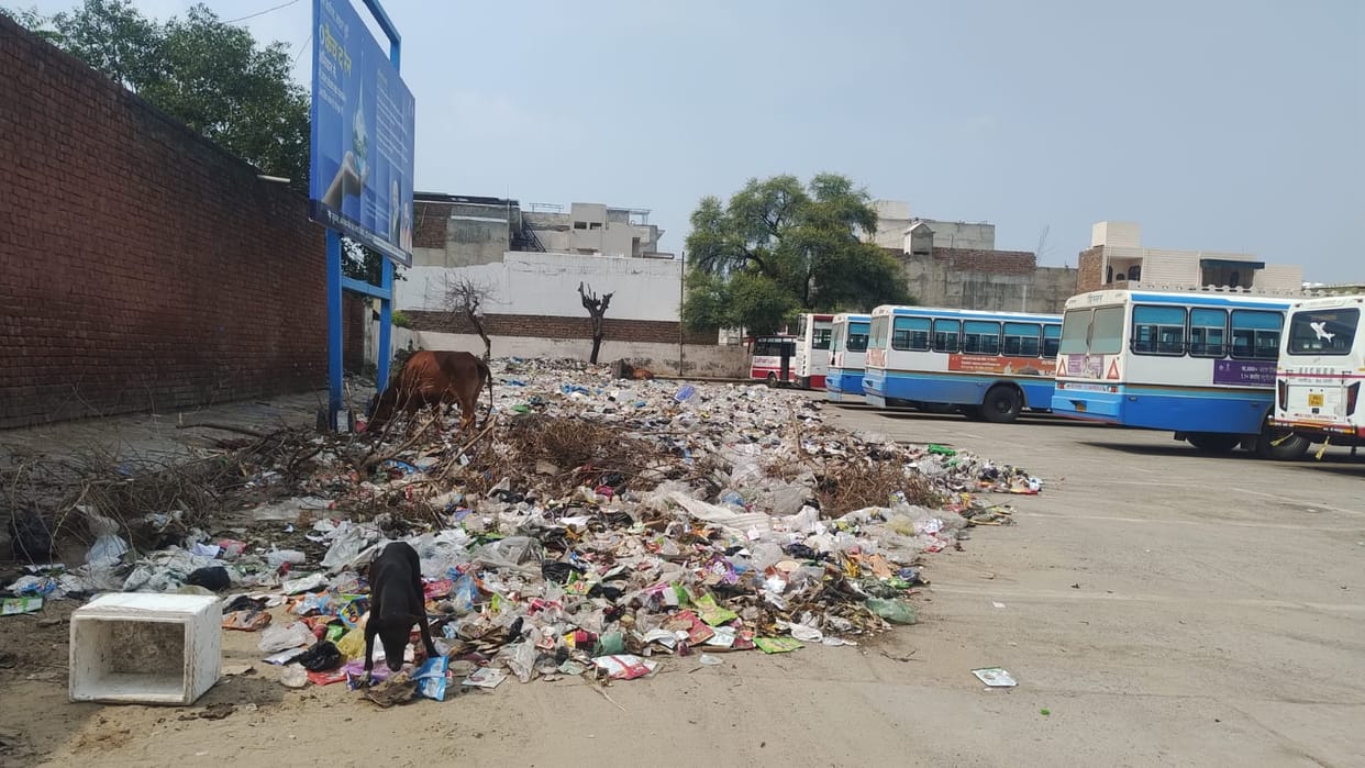 Garbage piled up at the bus stand.