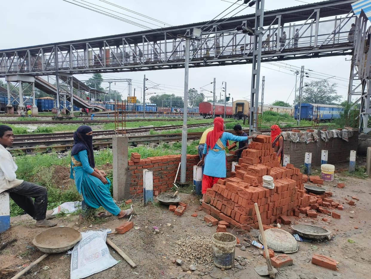 Railway administration swings into action; safety wall being constructed at the track crossing point.