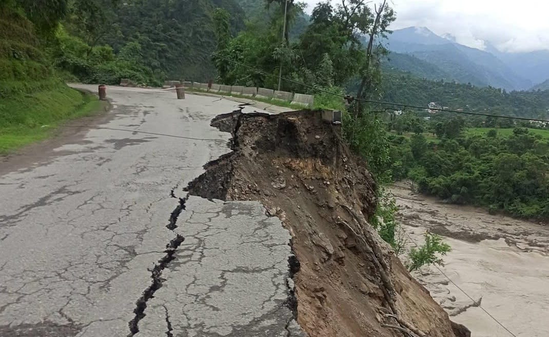 Flooding in the Trishuli River has caused a 30-meter road collapse on the Mugling-Kathmandu route, halting traffic.