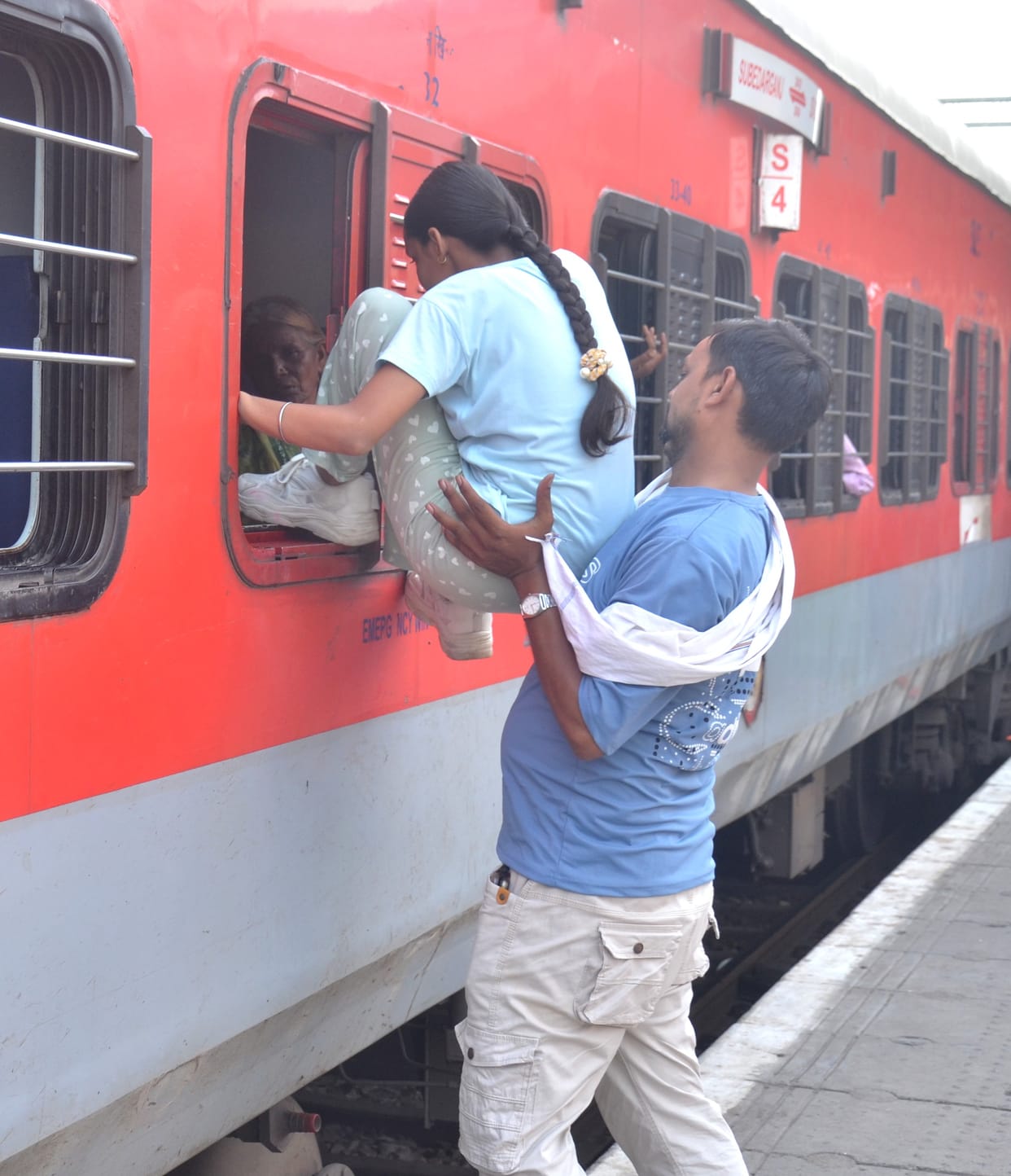 Climbing through the window, hanging onto the gate... a risky return