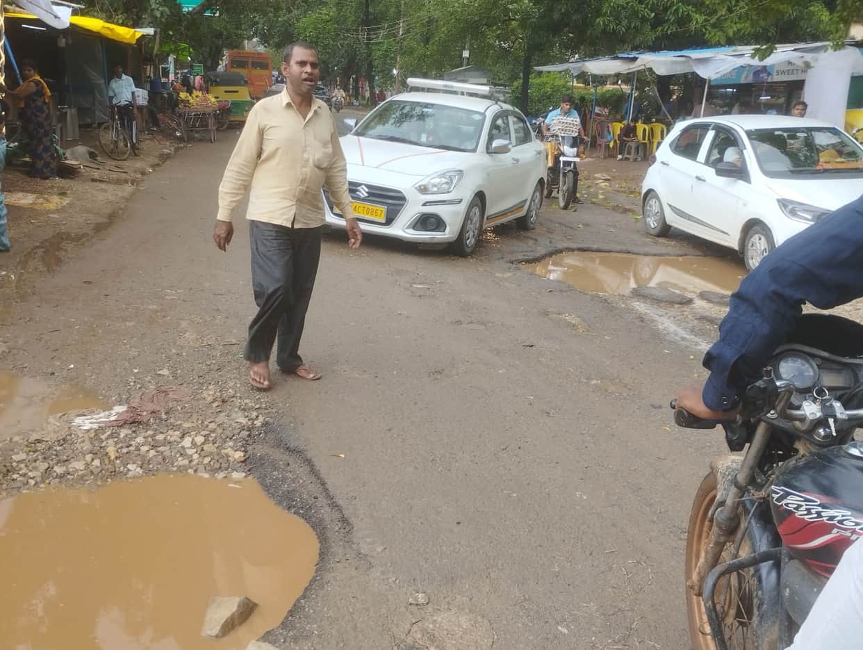 The surfacing washed away in the rain, and potholes on the road became visible.
