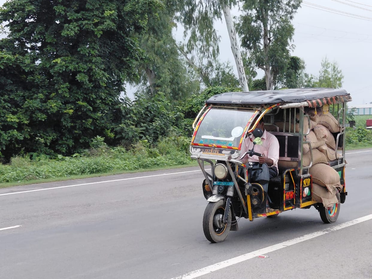 E-rickshaws speeding on the highway, putting passengers' lives at risk.
