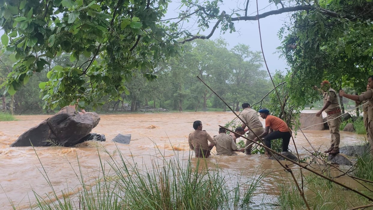 Two youths stranded as water level rises while bathing in river