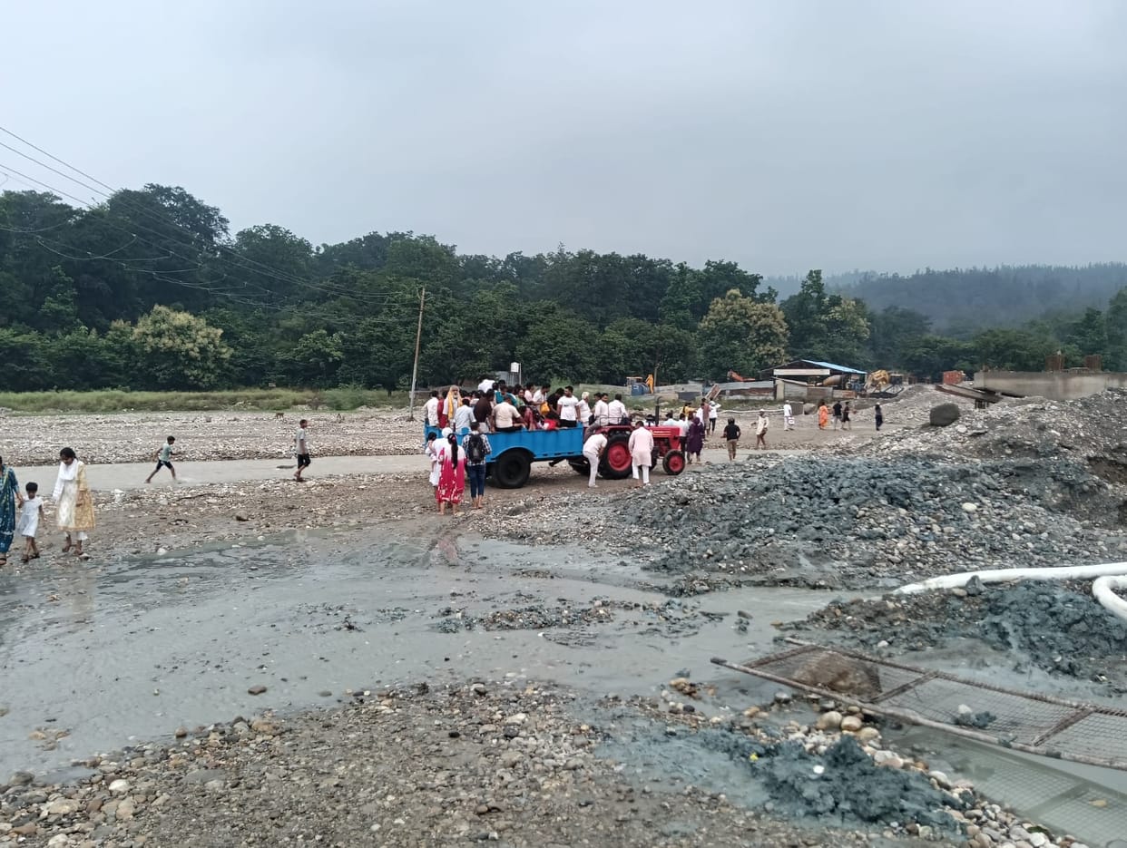 Villagers and bike riders stranded in rivers
