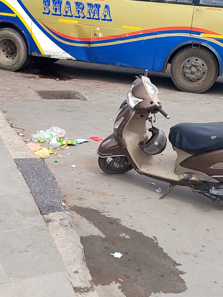 Piles of garbage scattered across the Una bus stand.