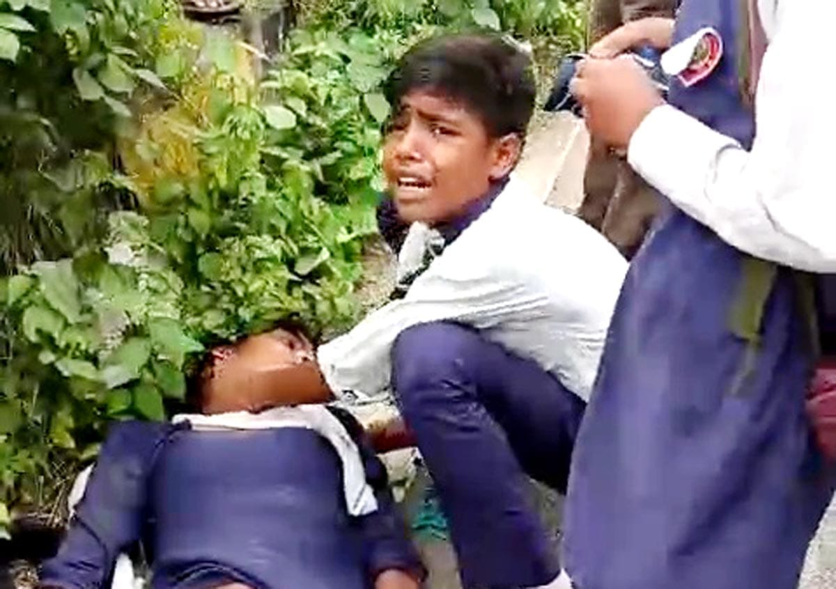 Two schoolgirls on a bicycle injured after being hit by a truck; condition critical.