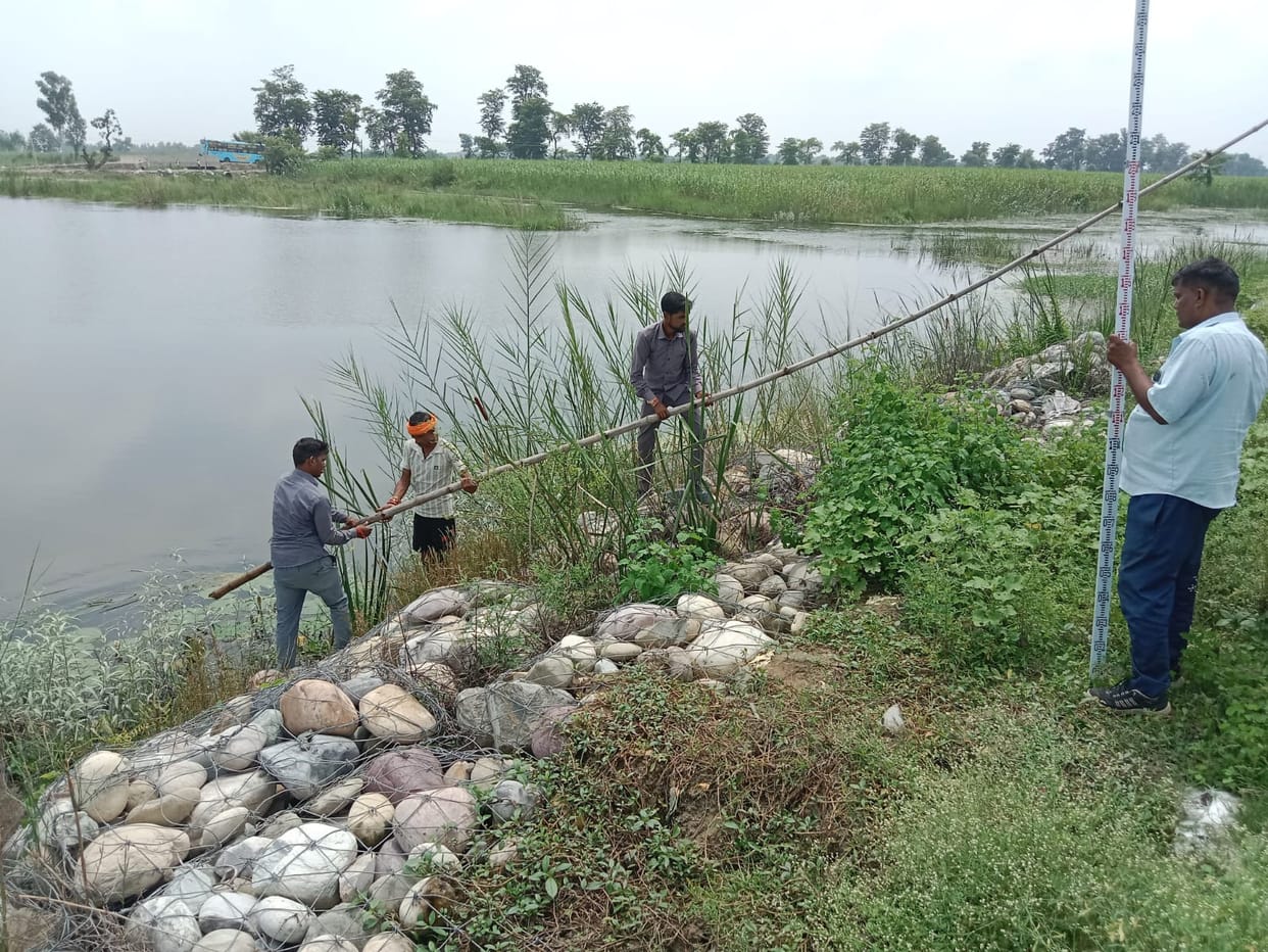 Railway employees checked the depth of potholes near Ataria crossing