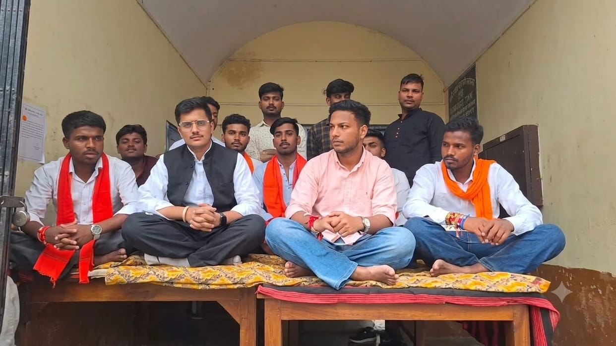 Students stage protest at SBS College; indefinite sit-in begins.