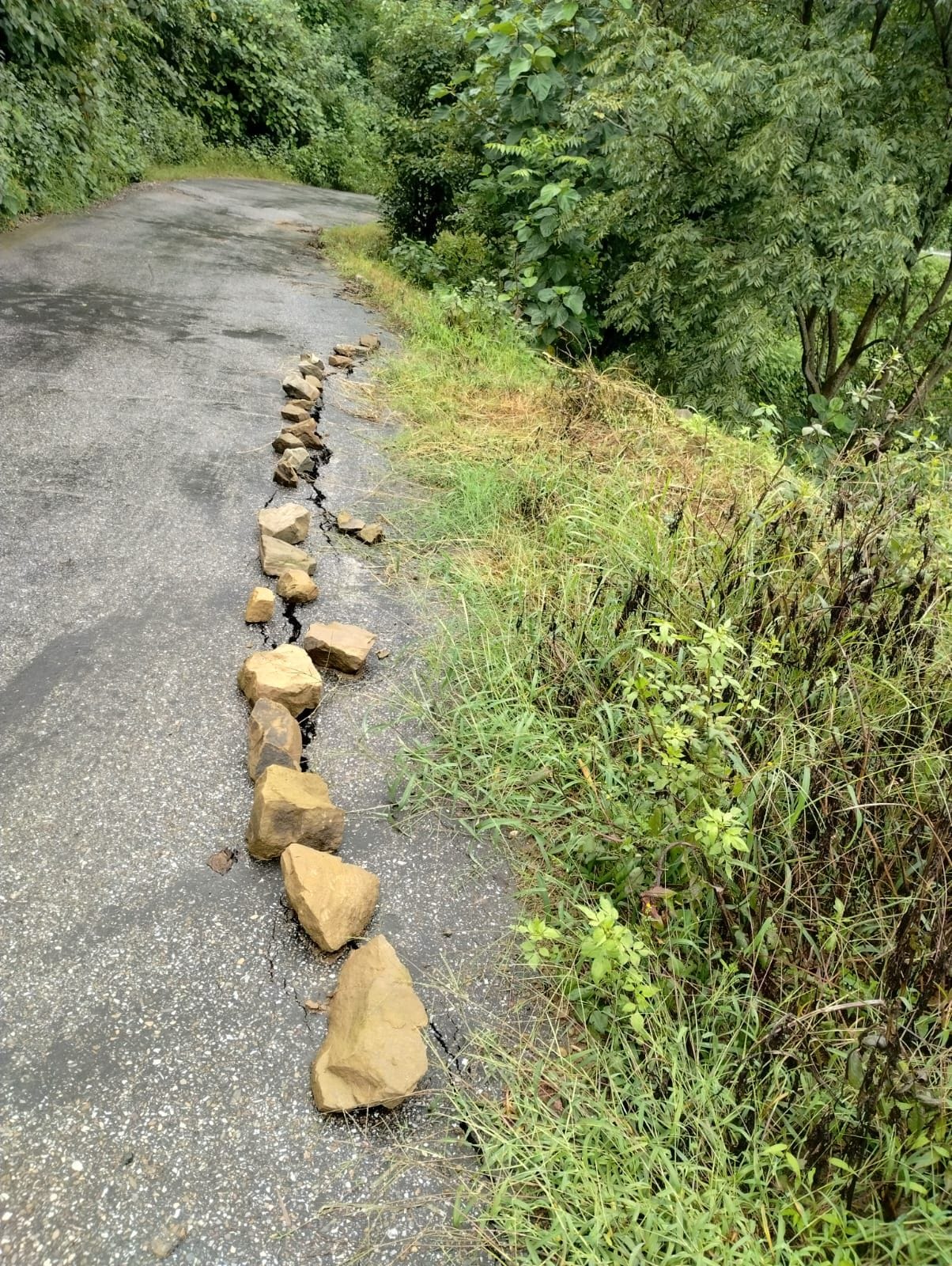 Road caves in again at the site of the bus accident.