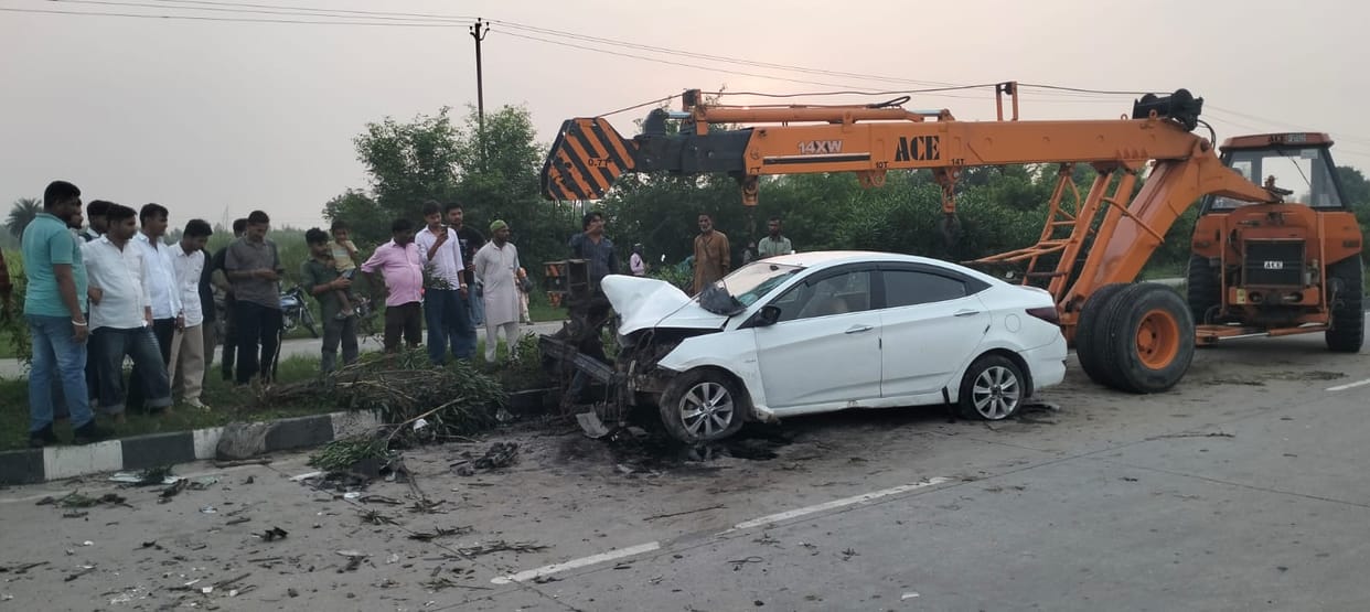 Car goes out of control after tyre burst, collides with another car.