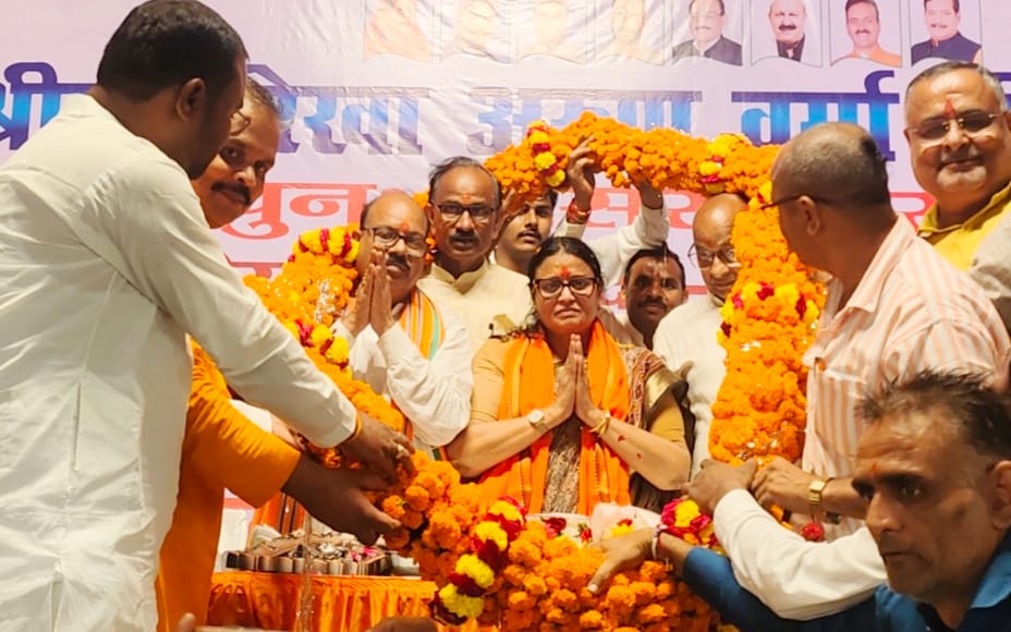 Bulldozers showered flowers, and laddus were used as a weight donation