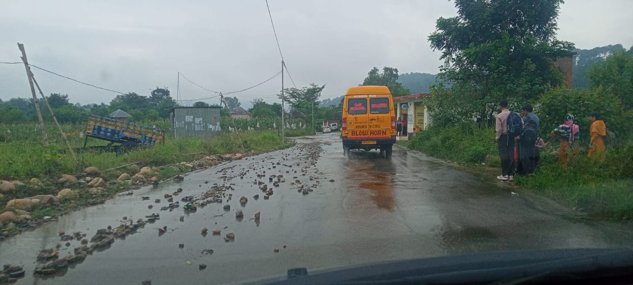 Rain tears up the road; potholes form in various places, increasing the risk of accidents.