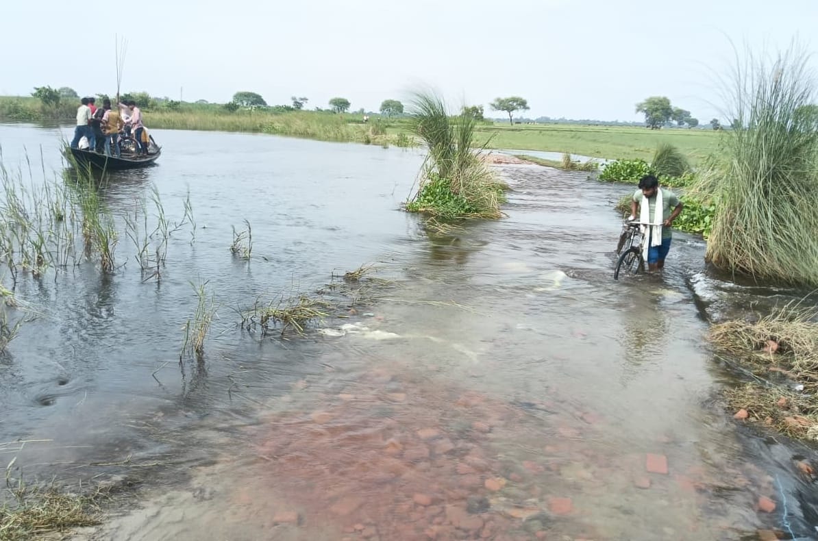 Flood: Saryu waters rise onto the road to Sonaura; education of 2,000 children disrupted.
