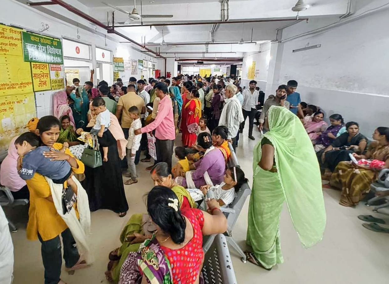 Crowd of patients surges at the district hospital.