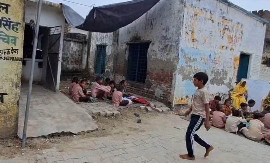 Roof missing... lessons under a tarpaulin.