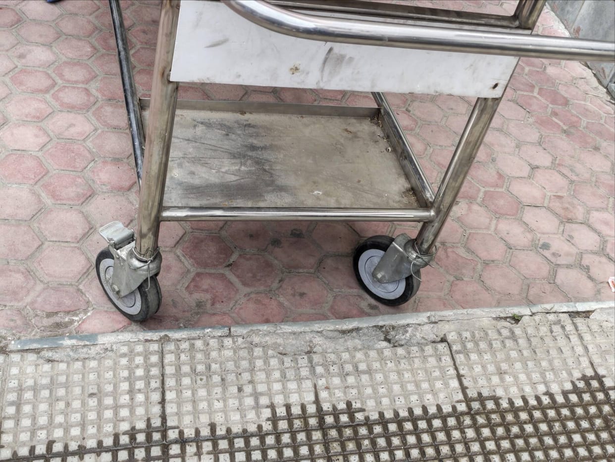 Wheelchairs and stretchers held together by wires at the regional hospital.
