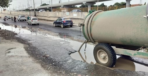 Water cleared from service road; highway becomes jam-free.