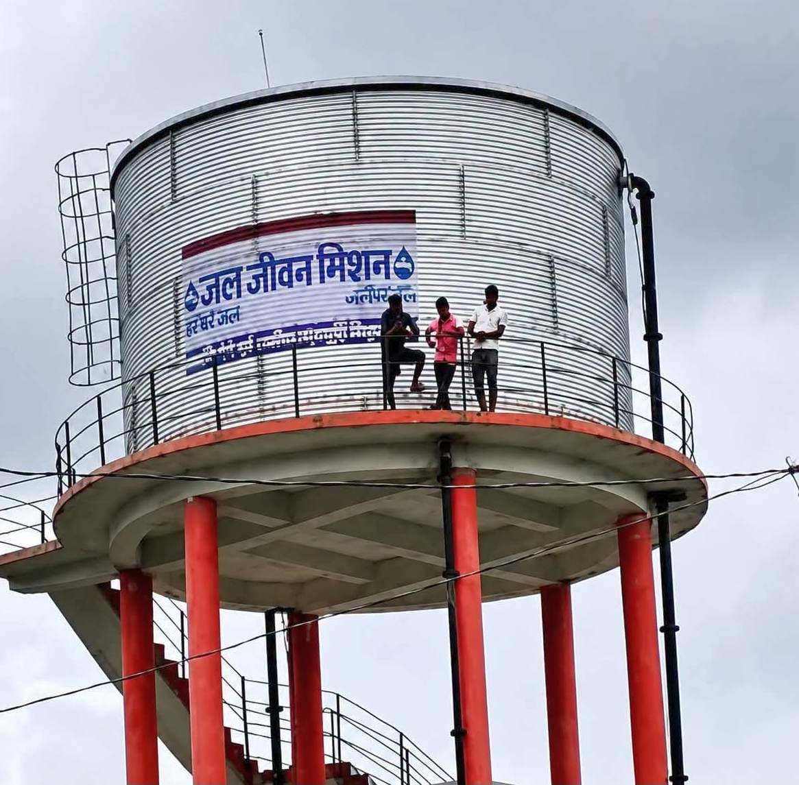 Three youths climbed a 50-foot-high overhead tank.