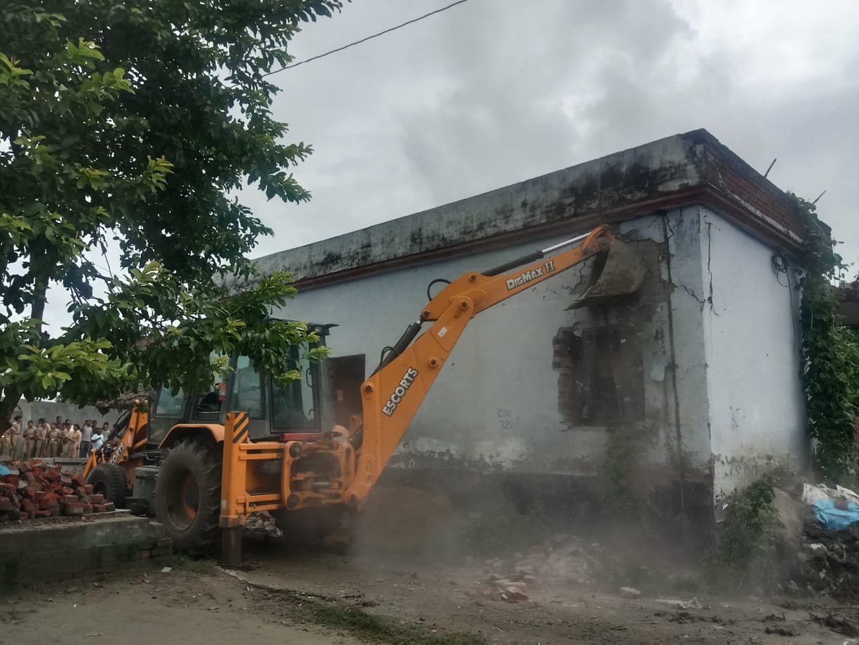 Bulldozer runs on house built on barn land