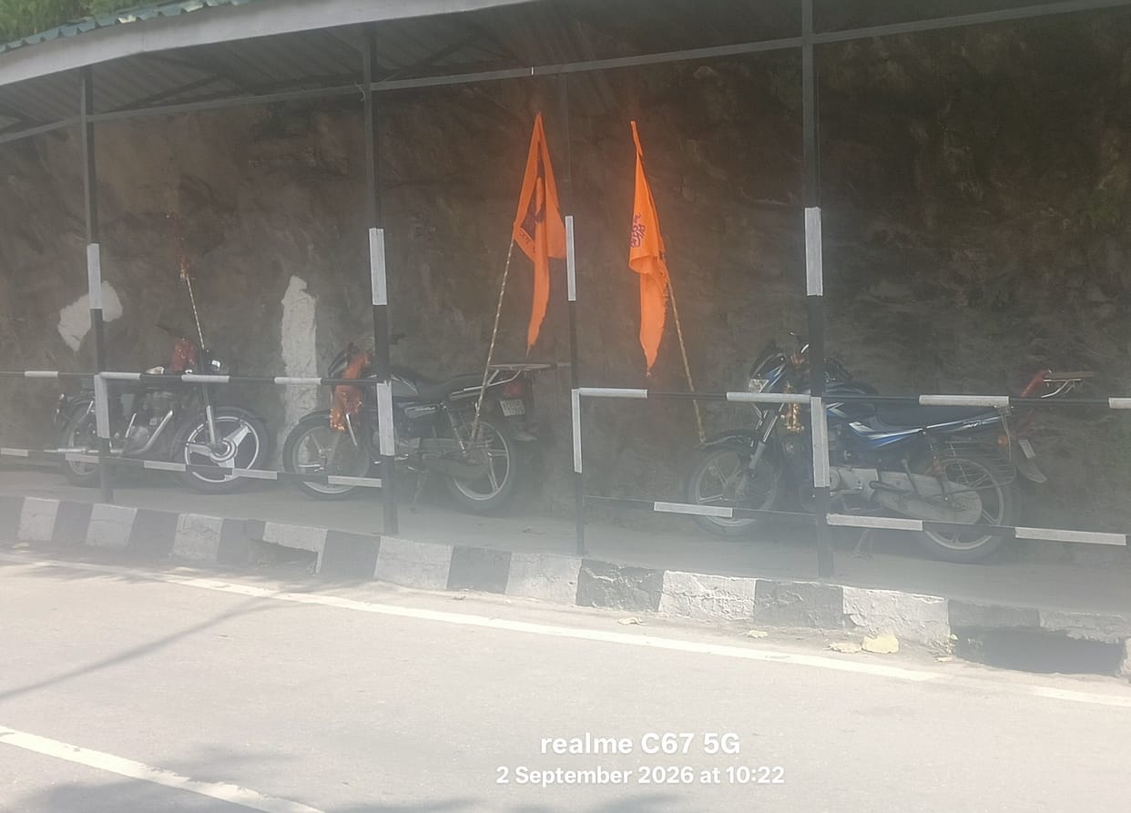 Parking on the footpath; pedestrians forced to walk on the road.