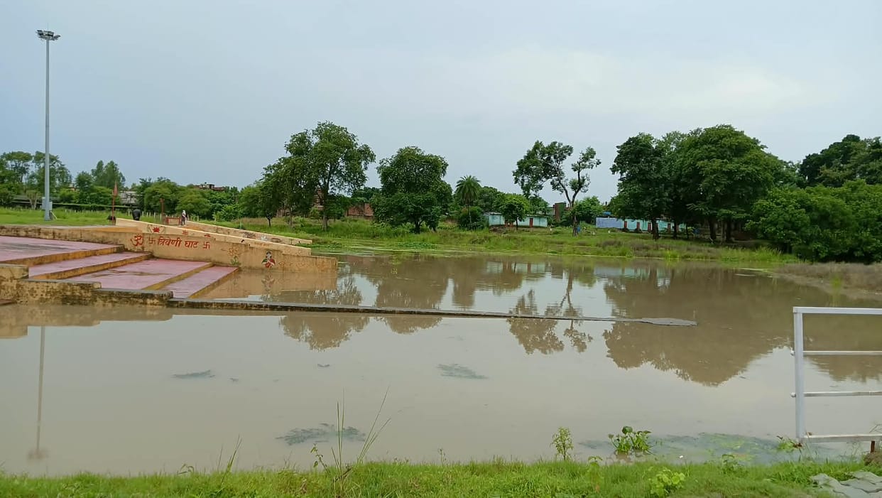 Water begins to accumulate in low-lying areas; villagers alarmed.