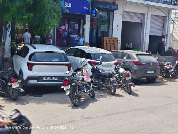 Customers inconvenienced by haphazard parking of vehicles in front of the bank.