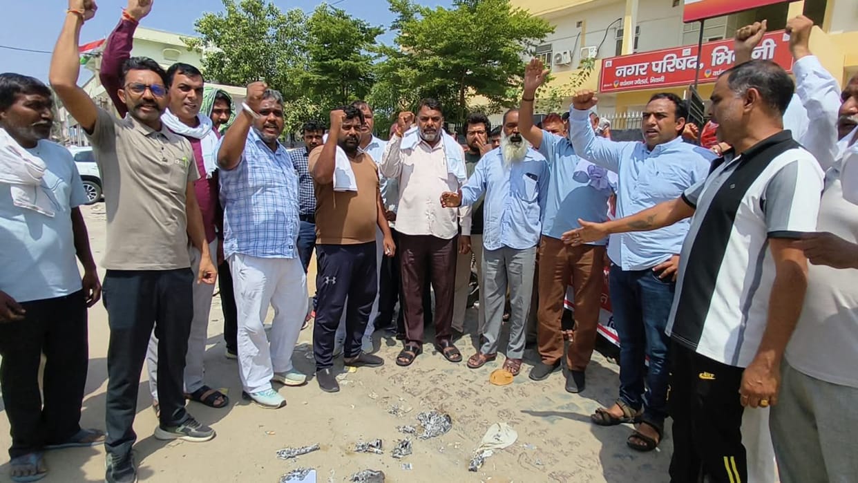 Employees outraged over order to clear garbage dump; burned copies of the orders.
