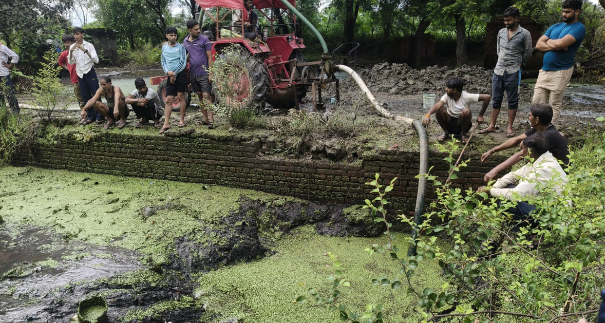 Pond next to school drained; no crocodile found.