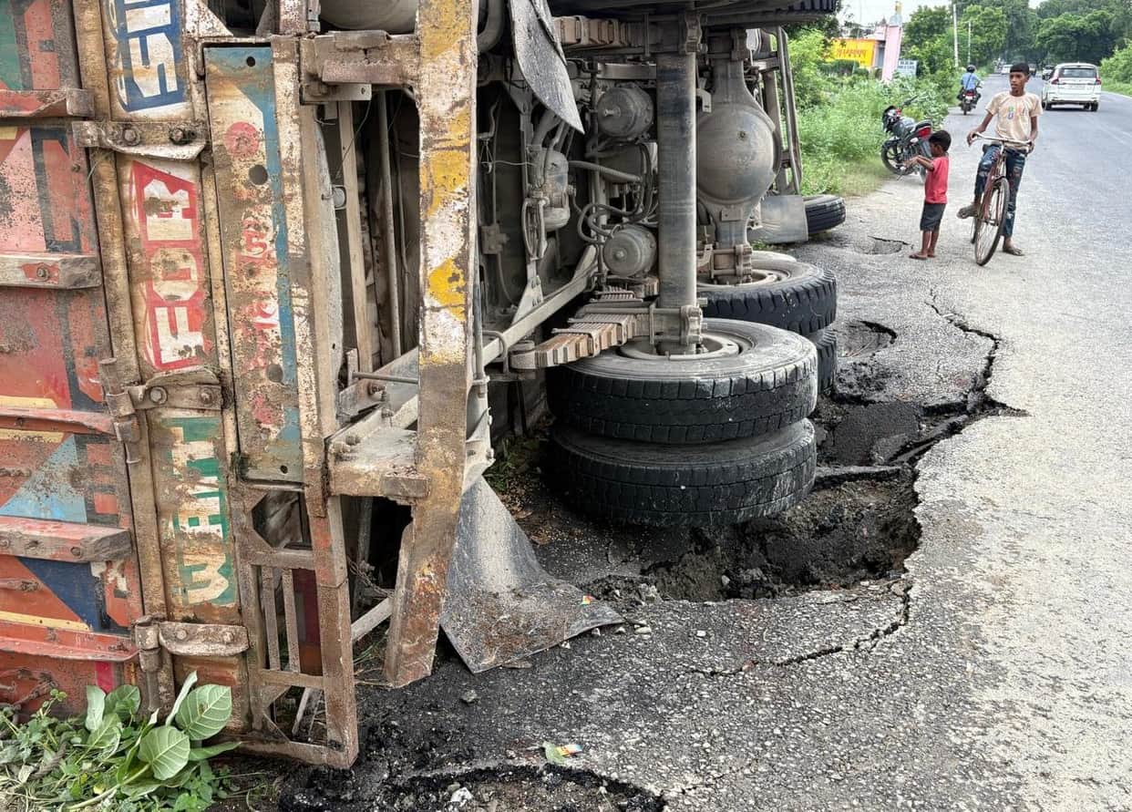 Under-construction road worth 34.41 crore caves in; truck overturns.